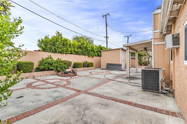 15112 Alderpoint Dr, La Mirada, CA 90638 - fenced backyard with a patio area, a storage unit, and an outdoor fire pit