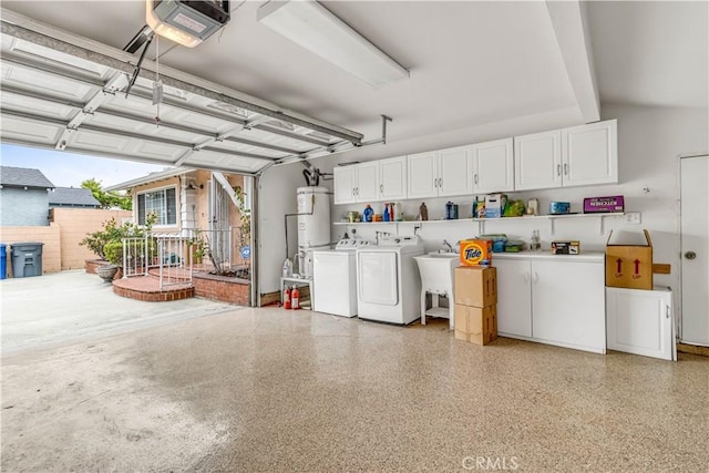 15112 Alderpoint Dr, La Mirada, CA 90638 - garage featuring separate washer and dryer, strapped water heater, and a garage door opener