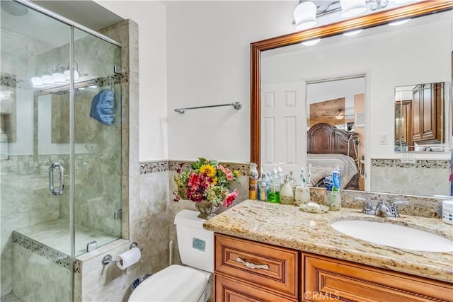 15112 Alderpoint Dr, La Mirada, CA 90638 - ensuite bathroom featuring vanity, a shower stall, tile walls, and wainscoting