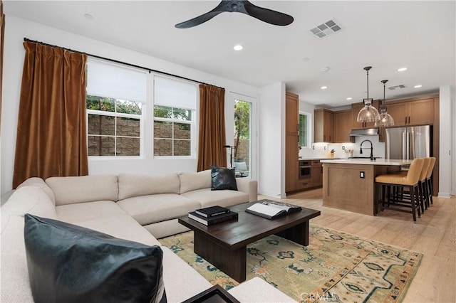 1146 E Cove Pl, Encinitas, CA 92024 - living area with light wood-style flooring, ceiling fan, and recessed lighting