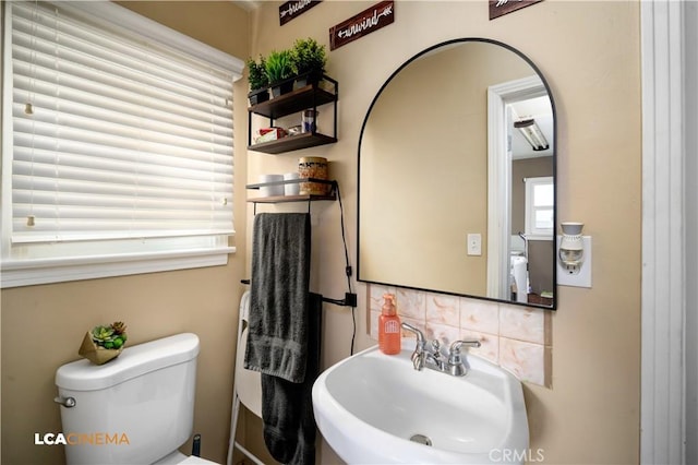 13271 Garzoli Ave, Mcfarland, CA 93250 - bathroom with a sink, toilet, and backsplash