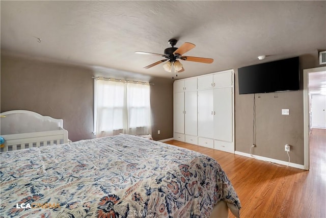 13271 Garzoli Ave, Mcfarland, CA 93250 - bedroom with light wood-type flooring, baseboards, ceiling fan, and a closet