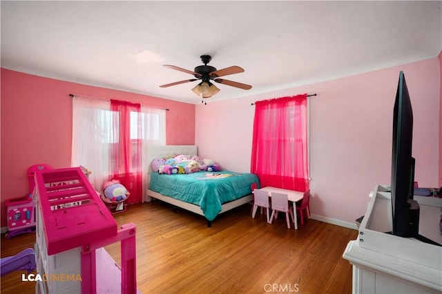 13271 Garzoli Ave, Mcfarland, CA 93250 - bedroom with wood finished floors and ceiling fan