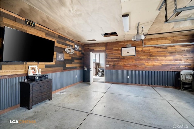 13271 Garzoli Ave, Mcfarland, CA 93250 - garage with wooden walls and a garage door opener