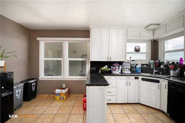 13271 Garzoli Ave, Mcfarland, CA 93250 - kitchen featuring dishwasher, a sink, white cabinets, dark countertops, and light tile patterned floors