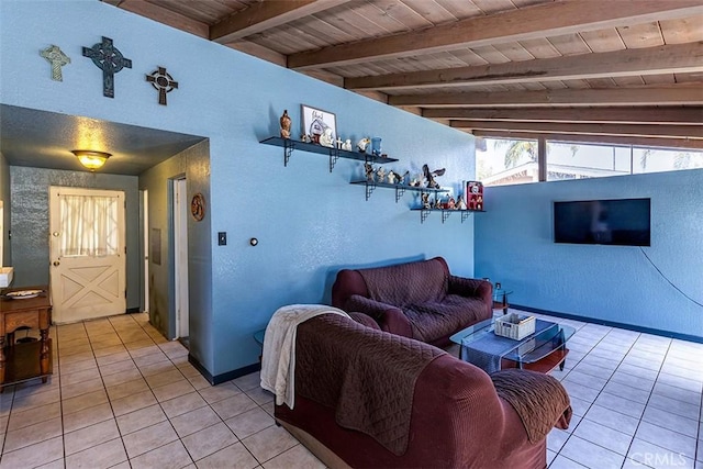 14124 Fonseca Ave, La Mirada, CA 90638 - living area featuring light tile patterned floors, wooden ceiling with exposed beams, baseboards, and a textured wall