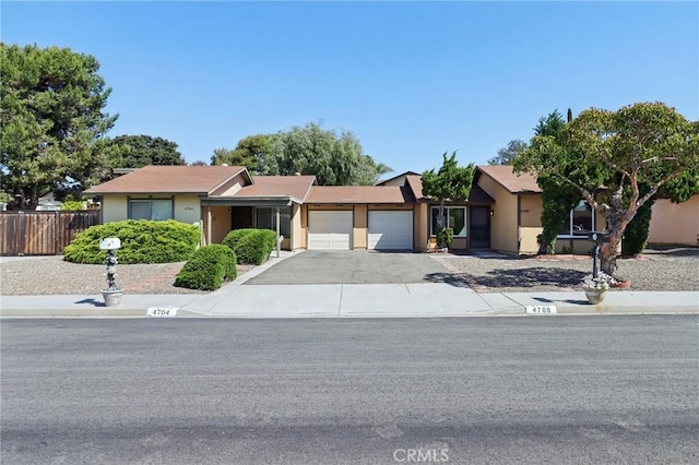4708 Sunrise Rdg, Oceanside, CA 92056 - view of front facade with an attached garage, stucco siding, and asphalt driveway