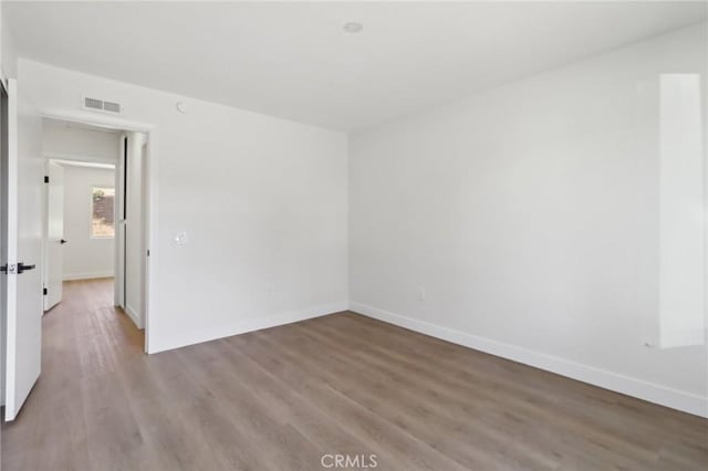 4708 Sunrise Rdg, Oceanside, CA 92056 - empty room with wood finished floors and baseboards