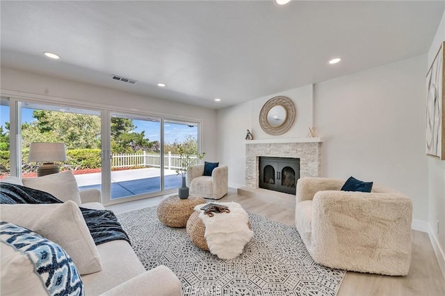 29461 Via Valverde, Laguna Niguel, CA 92677 - living area featuring a fireplace with raised hearth, wood finished floors, recessed lighting, and baseboards