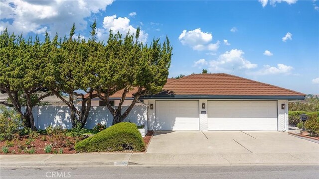 29461 Via Valverde, Laguna Niguel, CA 92677 - ranch-style home with a tile roof, brick siding, and driveway