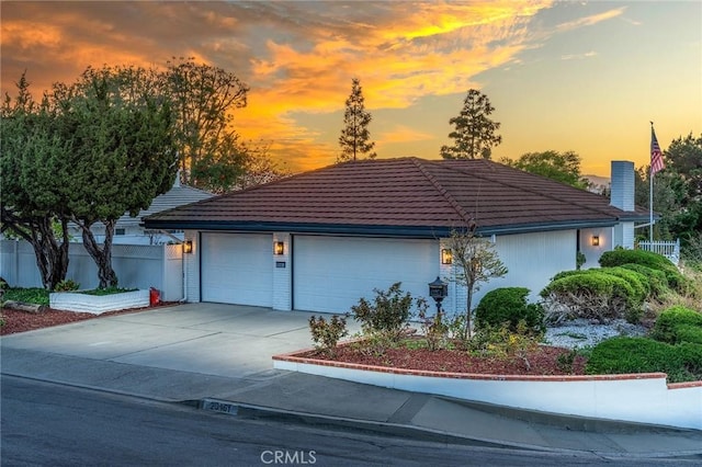 29461 Via Valverde, Laguna Niguel, CA 92677 - garage at dusk featuring concrete driveway