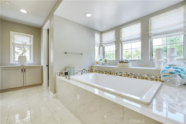 46 Shadybend, Irvine, CA 92602 - full bath featuring plenty of natural light, a bath, marble finish flooring, and recessed lighting