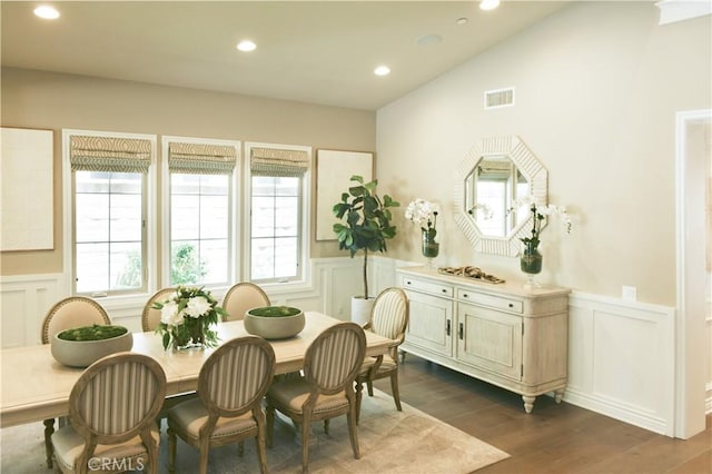 46 Shadybend, Irvine, CA 92602 - dining area with a decorative wall, a wainscoted wall, and dark wood-type flooring