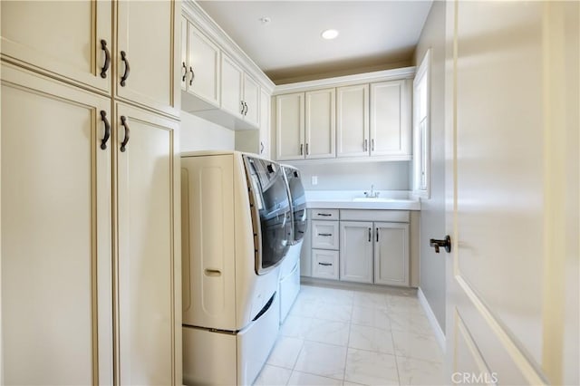 46 Shadybend, Irvine, CA 92602 - laundry room featuring washer and clothes dryer, cabinet space, light marble finish flooring, and recessed lighting