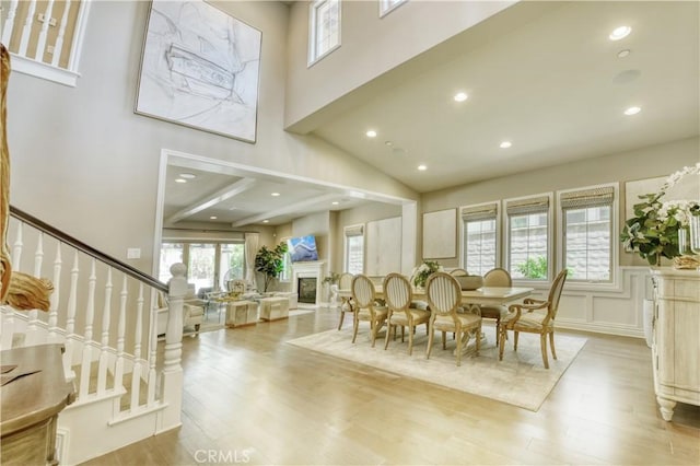 46 Shadybend, Irvine, CA 92602 - dining space with wood finished floors, stairs, recessed lighting, a high ceiling, and a fireplace