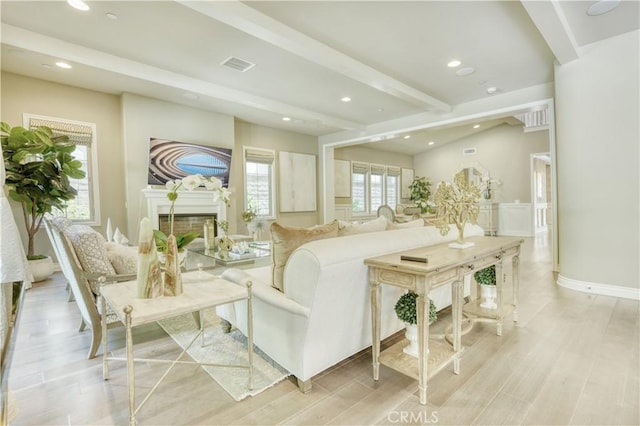 46 Shadybend, Irvine, CA 92602 - living area featuring beamed ceiling, recessed lighting, light wood-style floors, and a fireplace