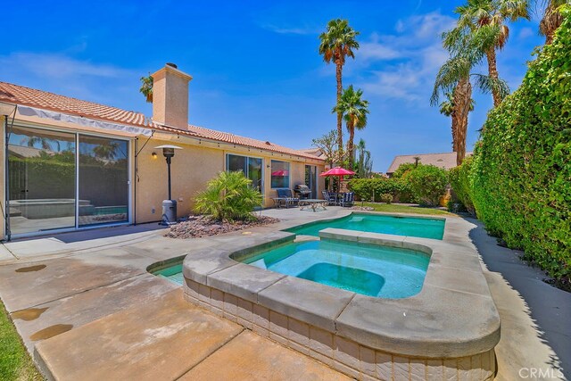 79030 Ladera Dr, La Quinta, CA 92253 - view of swimming pool with a patio area and an in-ground hot tub