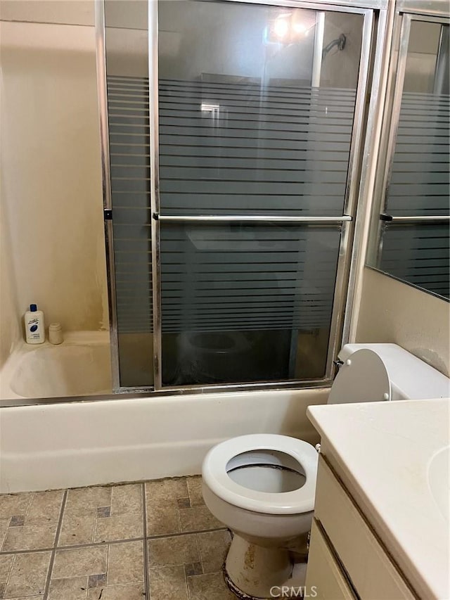 264 E Beverly Blvd Unit A, Montebello, CA 90640 - bathroom with toilet, vanity, enclosed tub / shower combo, and stone finish flooring