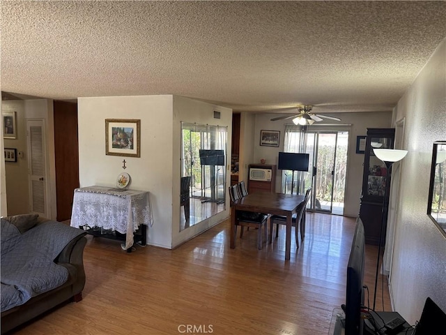 14222 Filmore St, Arleta, CA 91331 - dining area featuring a textured ceiling, wood finished floors, and ceiling fan