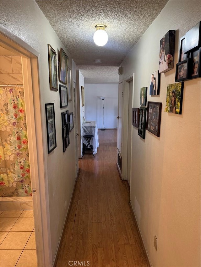 14222 Filmore St, Arleta, CA 91331 - hallway featuring a textured ceiling and light wood finished floors