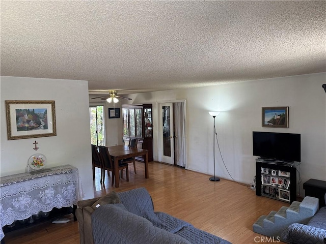 14222 Filmore St, Arleta, CA 91331 - living room featuring a textured ceiling, wood finished floors, and ceiling fan