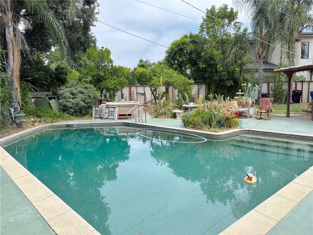 4317 Elmer Ave, North Hollywood, CA 91602 - swimming pool with a patio area and a fenced backyard