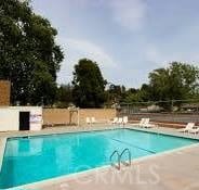 42769 Tierra Robles Pl, Temecula, CA 92592 - community pool with a patio area