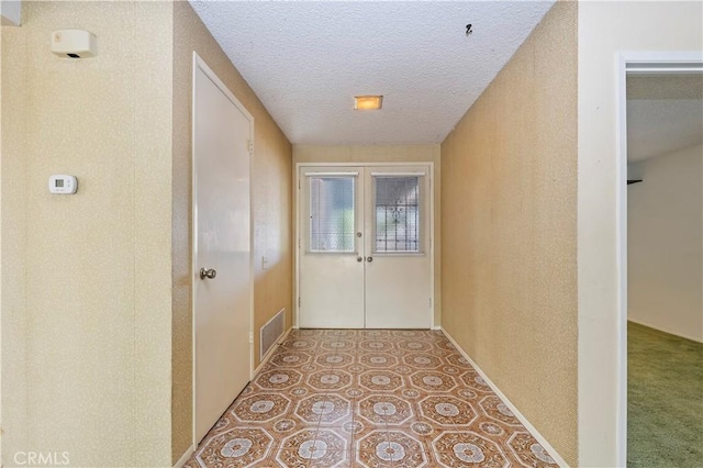 42769 Tierra Robles Pl, Temecula, CA 92592 - corridor with a textured ceiling, french doors, and baseboards