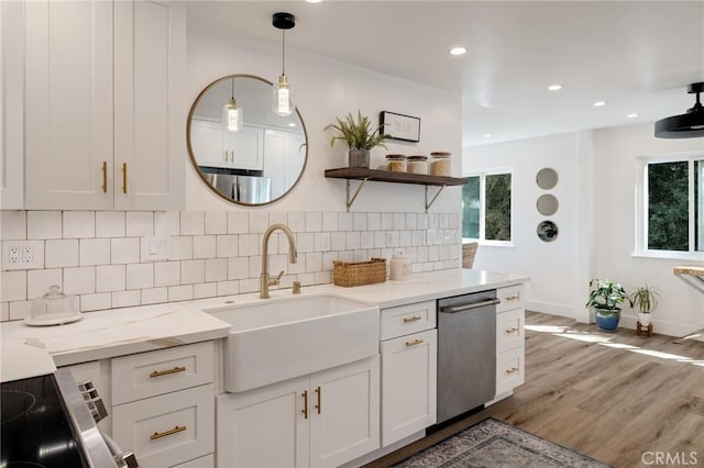 5700 Ravenspur Dr Unit 307, Rancho Palos Verdes, CA 90275 - kitchen with dishwasher, a sink, tasteful backsplash, baseboards, and wood finished floors