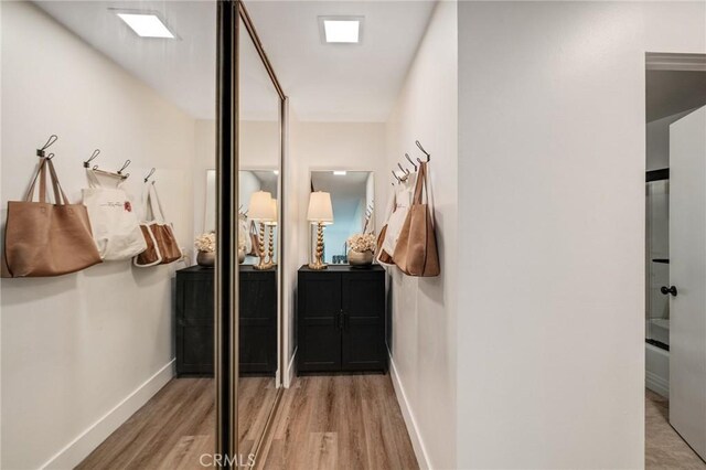 5700 Ravenspur Dr Unit 307, Rancho Palos Verdes, CA 90275 - corridor featuring wood finished floors and baseboards