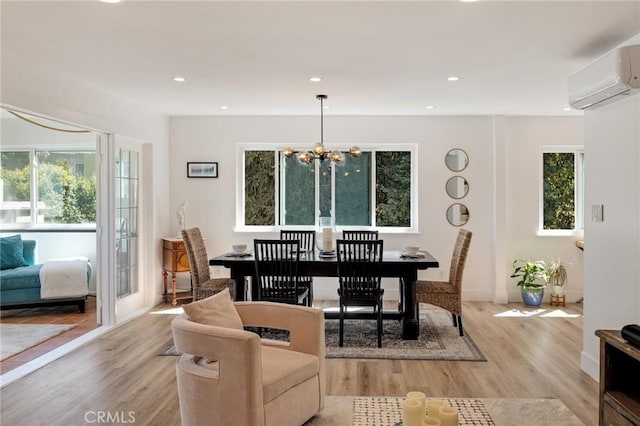 5700 Ravenspur Dr Unit 307, Rancho Palos Verdes, CA 90275 - dining area featuring a wall mounted air conditioner, a chandelier, light wood-style floors, and recessed lighting