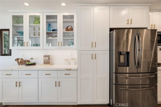 5700 Ravenspur Dr Unit 307, Rancho Palos Verdes, CA 90275 - kitchen with stainless steel fridge with ice dispenser, white cabinets, glass insert cabinets, and recessed lighting
