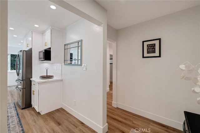 5700 Ravenspur Dr Unit 307, Rancho Palos Verdes, CA 90275 - corridor with light wood-style flooring, baseboards, and recessed lighting