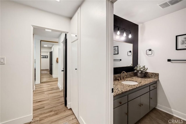5700 Ravenspur Dr Unit 307, Rancho Palos Verdes, CA 90275 - bathroom with baseboards, vanity, and wood finished floors