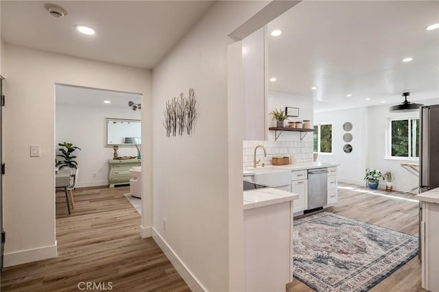 5700 Ravenspur Dr Unit 307, Rancho Palos Verdes, CA 90275 - hallway featuring a sink, light wood-style flooring, baseboards, and recessed lighting