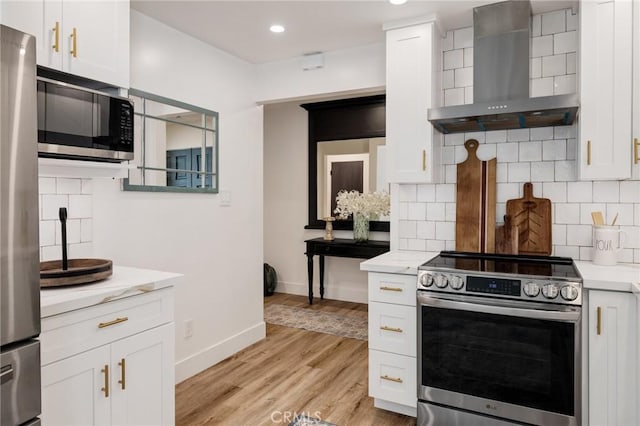 5700 Ravenspur Dr Unit 307, Rancho Palos Verdes, CA 90275 - kitchen with appliances with stainless steel finishes, wall chimney exhaust hood, tasteful backsplash, and recessed lighting