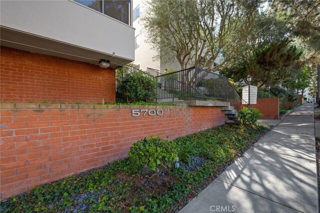 5700 Ravenspur Dr Unit 307, Rancho Palos Verdes, CA 90275 - view of side of property featuring brick siding and stairs