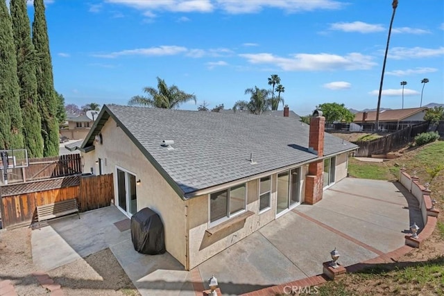 1326 Rosehill Dr, Riverside, CA 92507 - rear view of property with a patio, stucco siding, roof with shingles, and a chimney