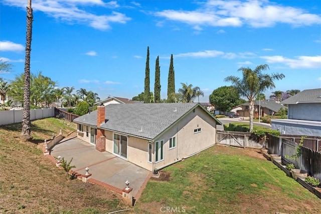 1326 Rosehill Dr, Riverside, CA 92507 - rear view of house featuring a patio area, a fenced backyard, a chimney, stucco siding, and roof with shingles