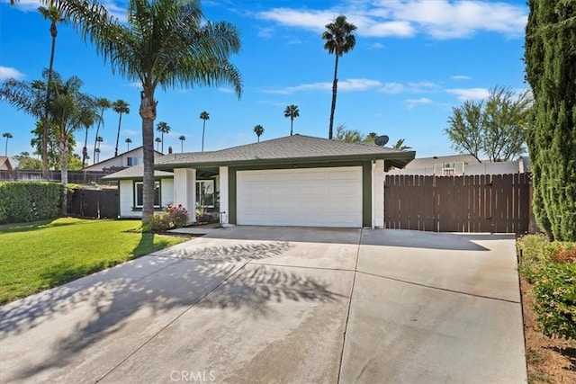 1326 Rosehill Dr, Riverside, CA 92507 - view of front of house featuring a garage, driveway, and stucco siding