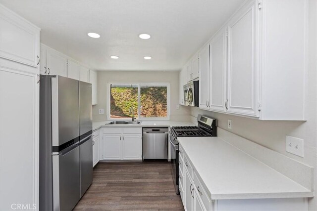 1326 Rosehill Dr, Riverside, CA 92507 - kitchen featuring stainless steel appliances, white cabinets, light countertops, and recessed lighting