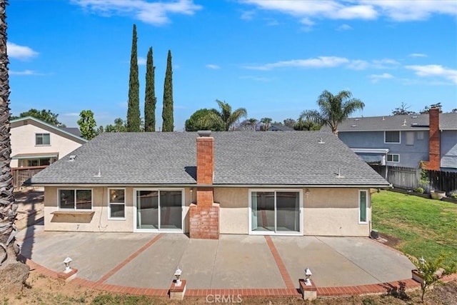 1326 Rosehill Dr, Riverside, CA 92507 - back of house with stucco siding, a patio, roof with shingles, and a chimney