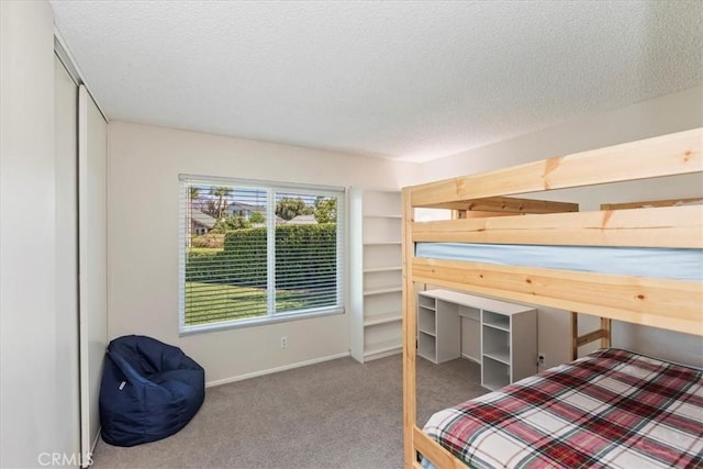 1326 Rosehill Dr, Riverside, CA 92507 - bedroom featuring carpet floors and a textured ceiling