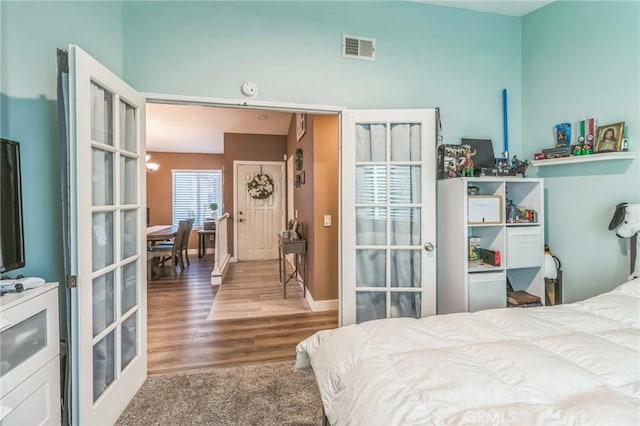 2618 W Loma Vista Dr, Rialto, CA 92377 - bedroom featuring wood finished floors, french doors, and baseboards