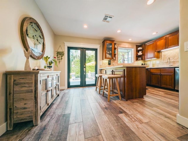 8635 La Butte Ln, Santee, CA 92071 - kitchen featuring french doors, light wood-type flooring, open shelves, healthy amount of natural light, and recessed lighting