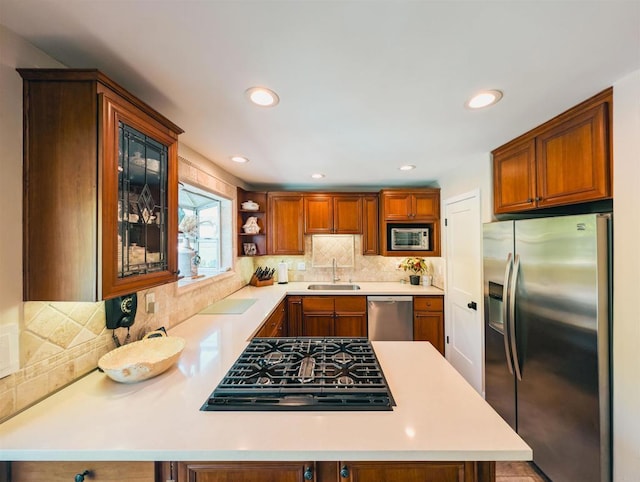 8635 La Butte Ln, Santee, CA 92071 - kitchen featuring appliances with stainless steel finishes, a sink, light countertops, backsplash, and recessed lighting