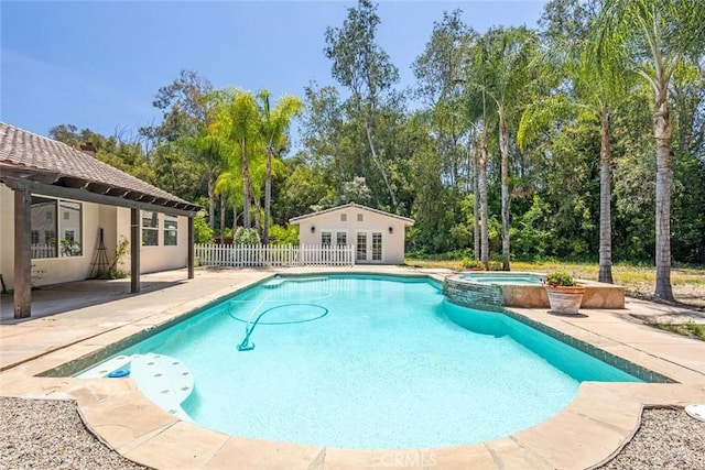 24563 Calle Perla, Murrieta, CA 92562 - view of swimming pool featuring french doors, a patio area, a pool with connected hot tub, and view of wooded area