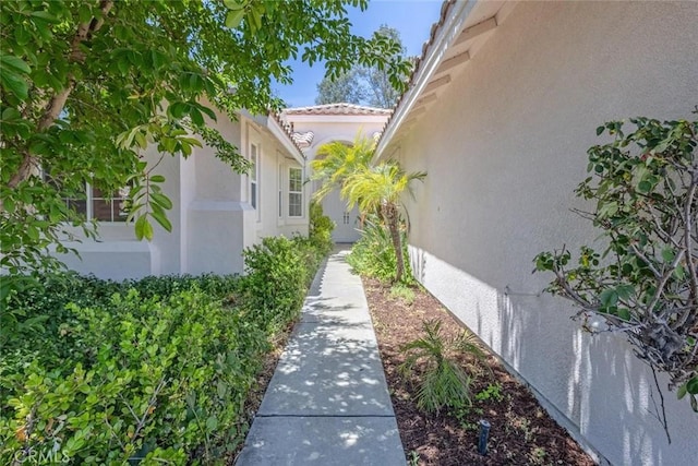 24563 Calle Perla, Murrieta, CA 92562 - view of side of property featuring stucco siding and a tile roof