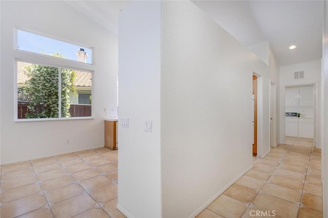 24563 Calle Perla, Murrieta, CA 92562 - hallway featuring light tile patterned floors, recessed lighting, and baseboards
