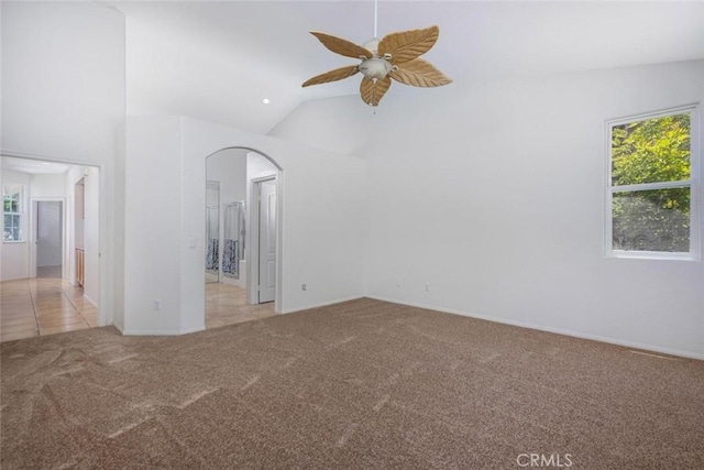 24563 Calle Perla, Murrieta, CA 92562 - unfurnished room with light carpet, ceiling fan, arched walkways, high vaulted ceiling, and baseboards
